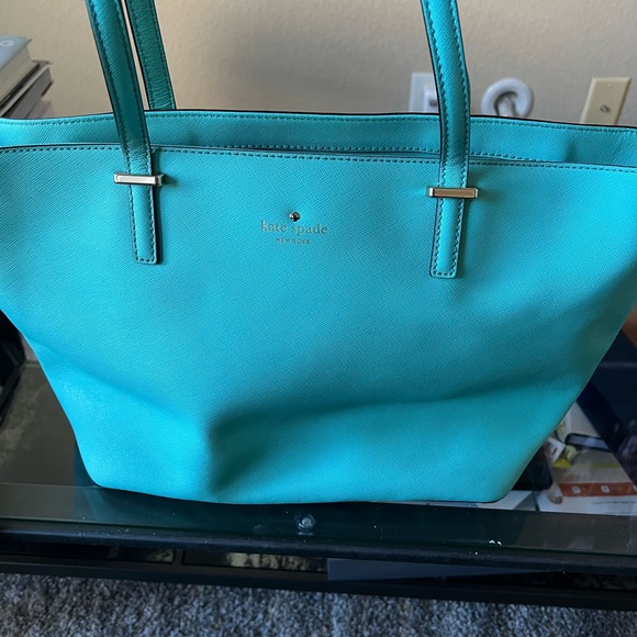Kate spade tote with inside zipper pocket and two pockets on other side. - Picture 7 of 14